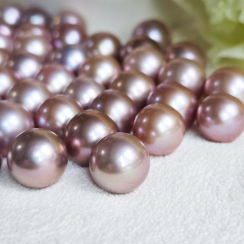 Close-up of large, round, high-luster Edison pearls showcasing vibrant colors and superior nacre quality in freshwater pearl industry revolution