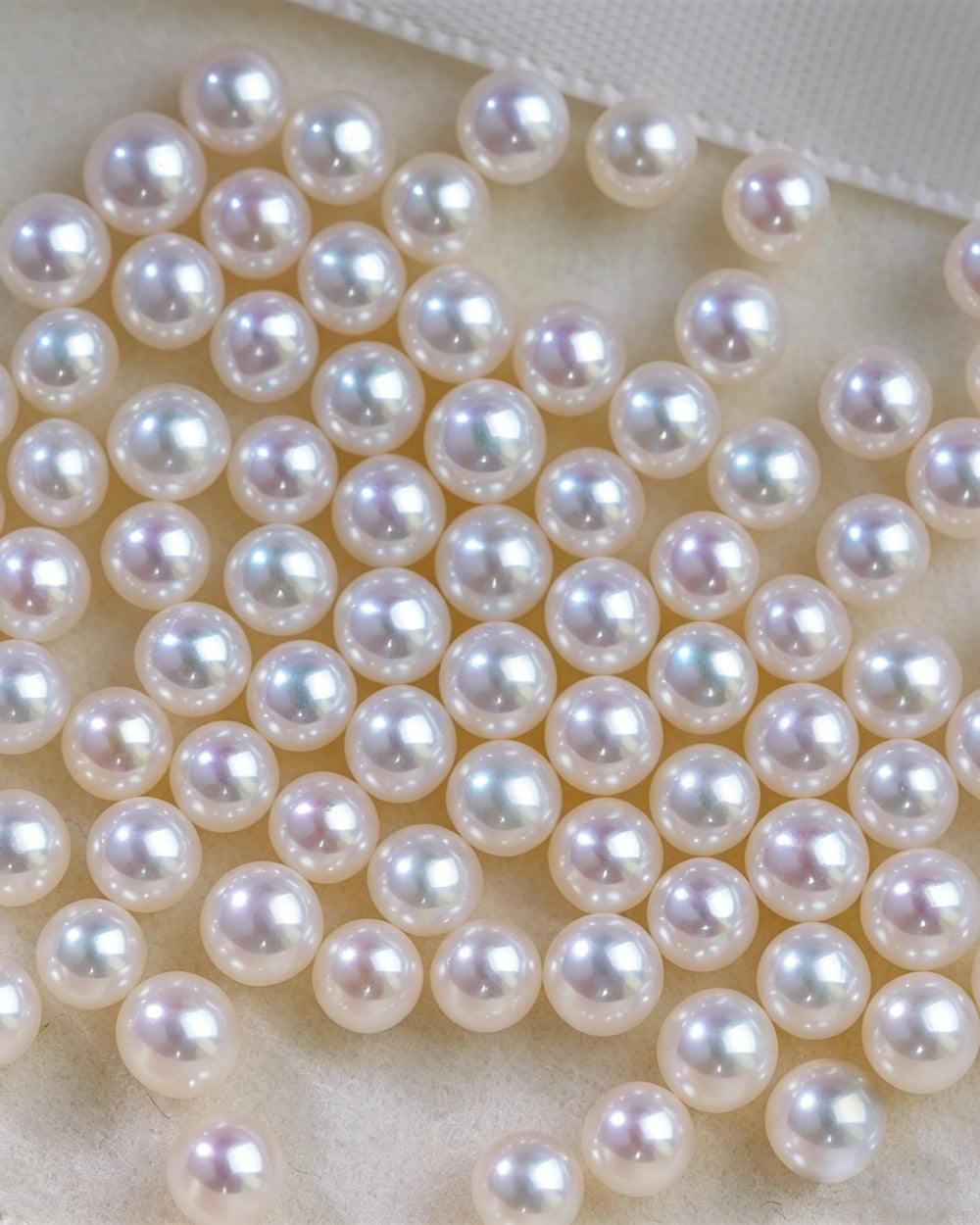 Close-up of round, lustrous Freshwater Akoya pearls with pink and lavender overtones