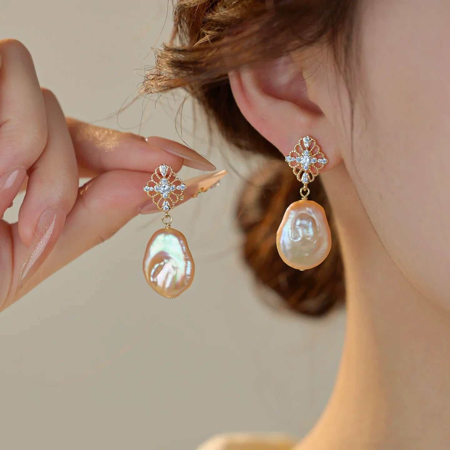 Freshwater pearl earrings collection including studs, drop earrings, and hoops displaying natural iridescence and elegance