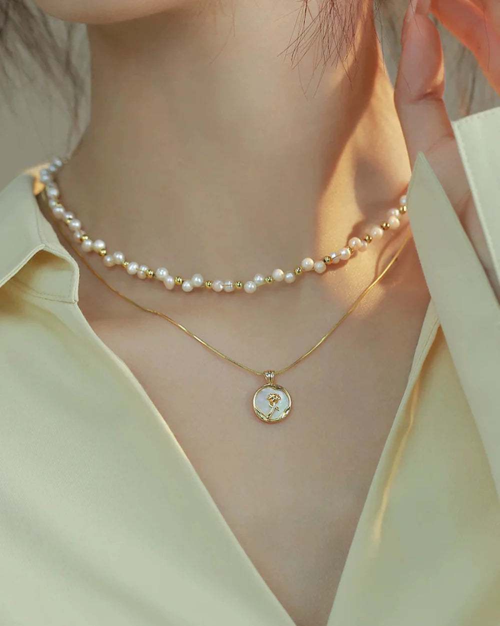 Freshwater pearl necklace with lustrous white beads on a black background