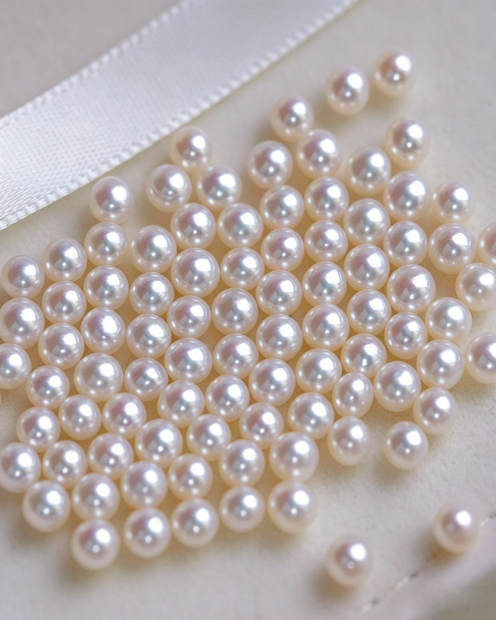 Close-up of white pearls on a white background