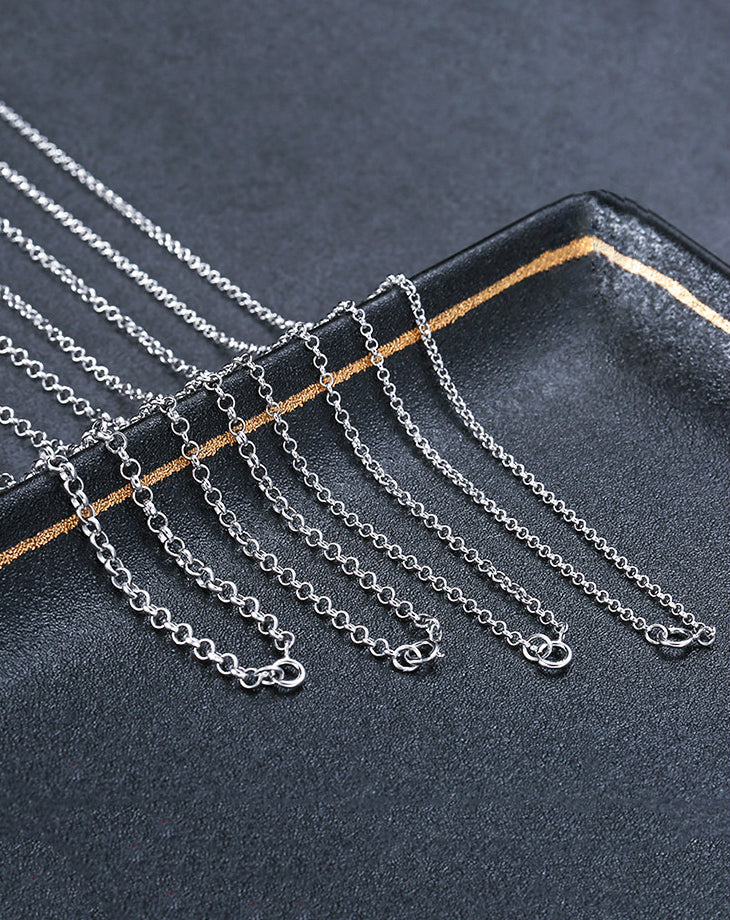 Silver chains on a dark surface