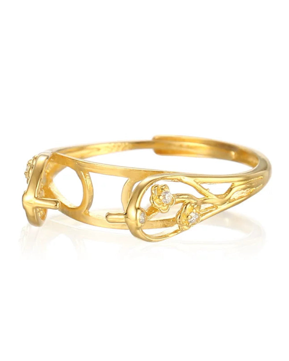 Gold bracelet with floral design on a white background