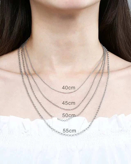 Silver necklace displayed on a person with measurements indicated.