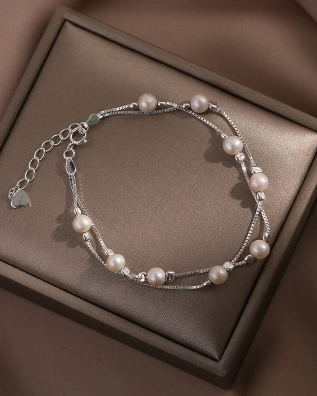 Pearl bracelet on a brown box