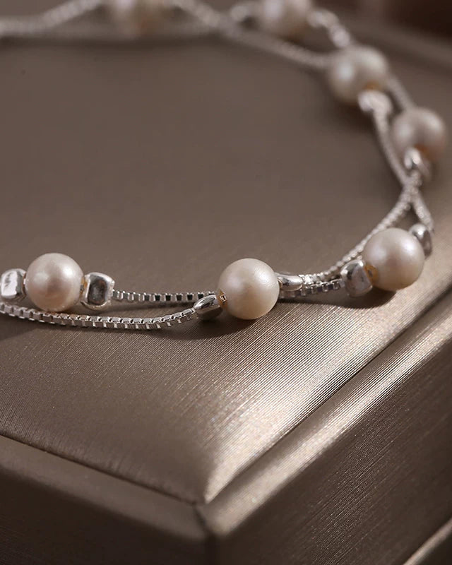 Pearl bracelet on a wooden surface