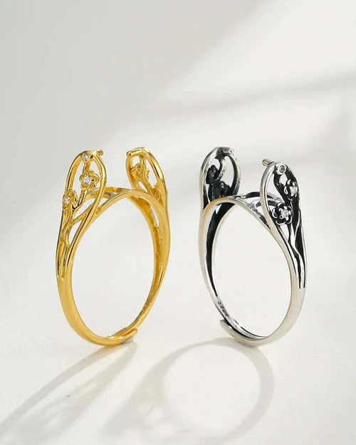 Gold and silver rings with intricate designs on a white background