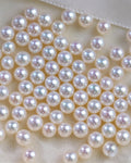 Close-up of a string of pearls on a white background