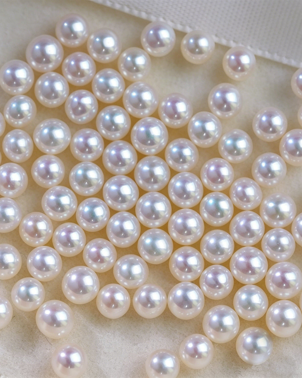 Close-up of a string of pearls on a white background