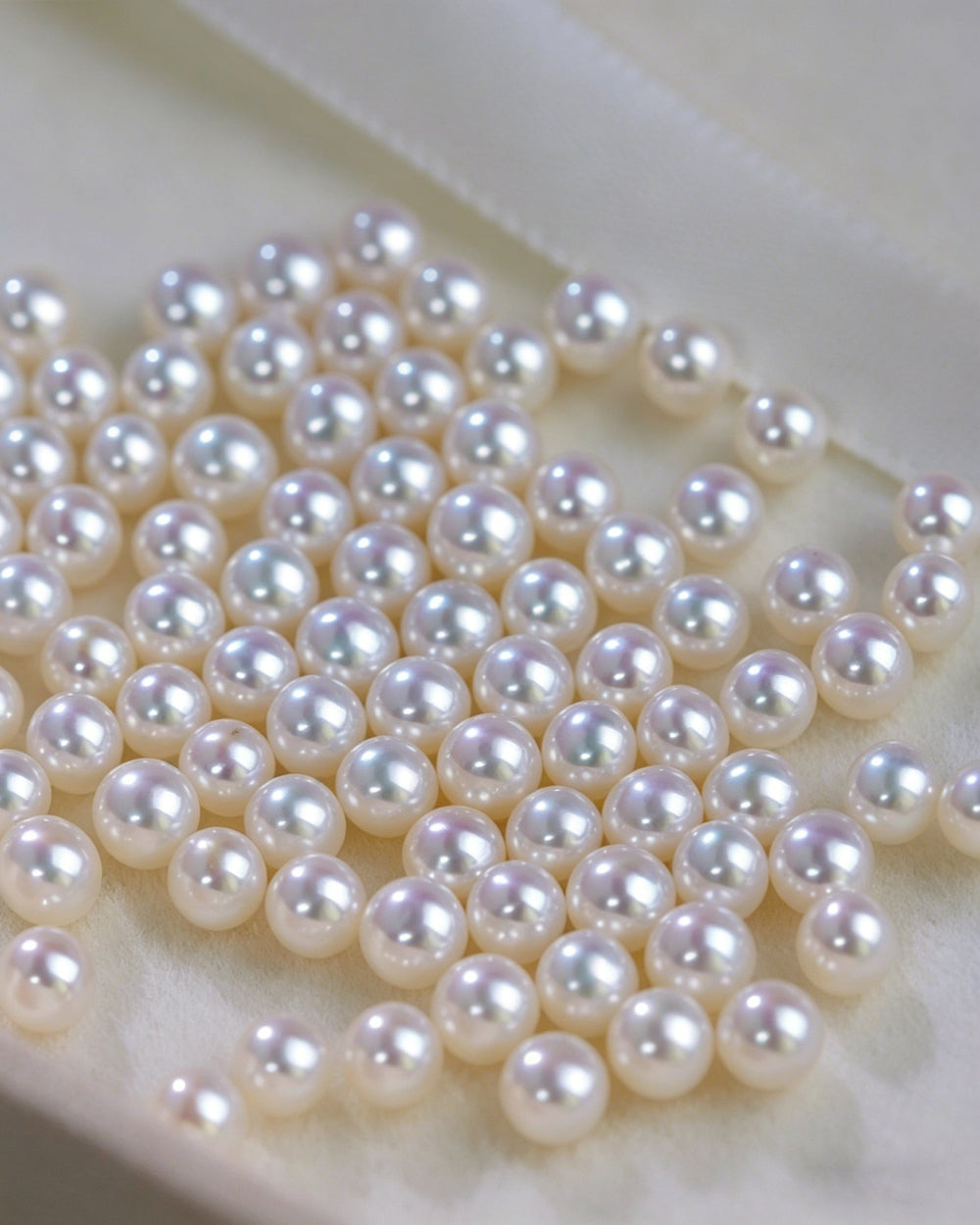 Pearl necklace on a white surface