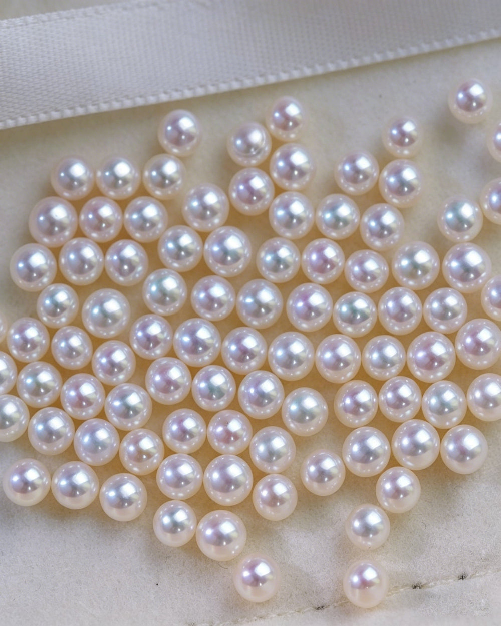 Close-up of white pearls on a white background