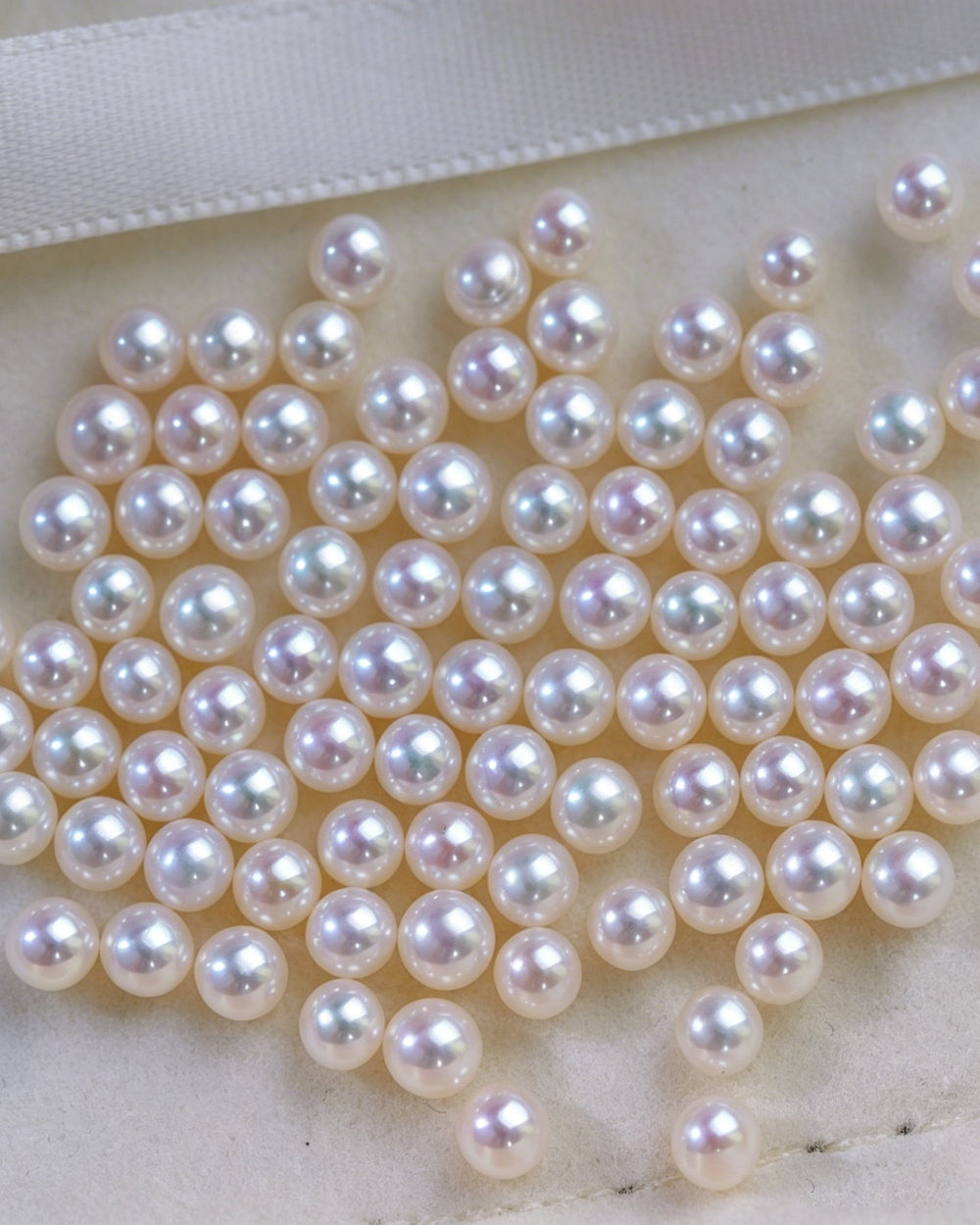 Close-up of white pearls on a white background