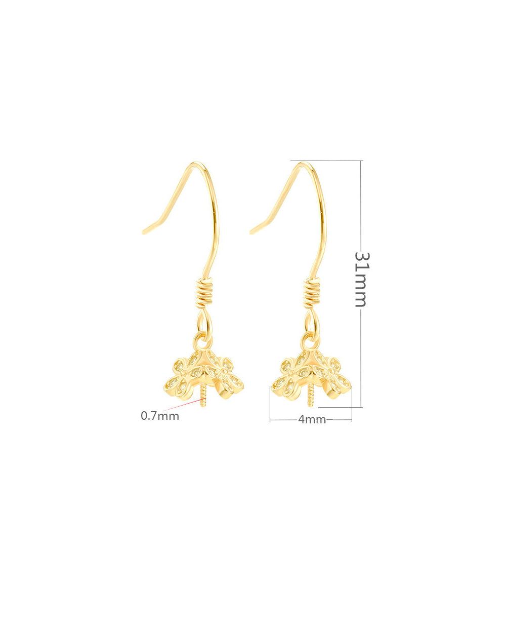 Gold earrings with measurements on a white background